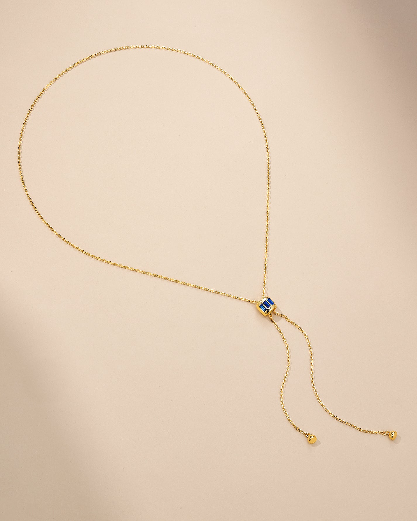 Sapphire Style Pendant Lariat Necklace In Gold Tone